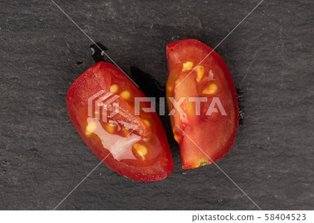 Fresh red tomato on grey stone Fresh red tomato on grey stone 58404523