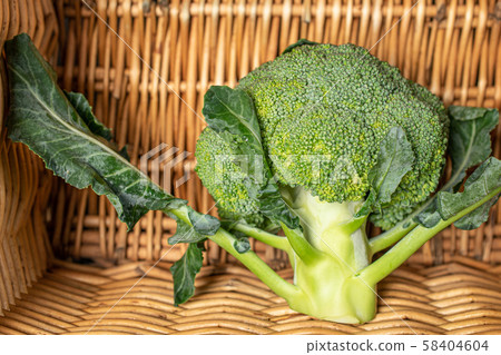 Fresh green broccoli with braided rattan Fresh green broccoli with braided rattan 58404604
