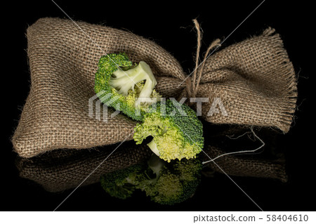 Fresh green broccoli isolated on black glass 58404610