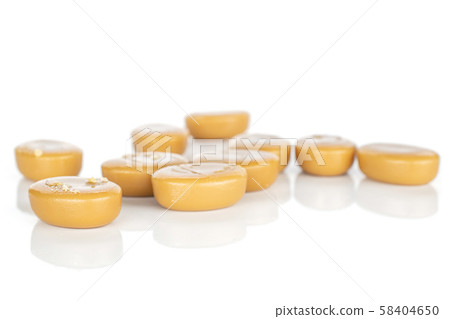 Brown caramel candy isolated on white 58404650