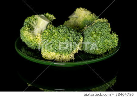 Fresh green broccoli isolated on black glass Fresh green broccoli isolated on black glass 58404786