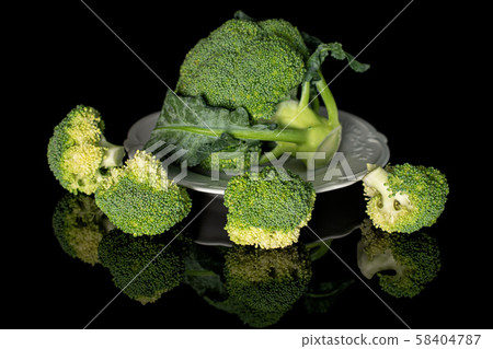 Fresh green broccoli isolated on black glass Fresh green broccoli isolated on black glass 58404787