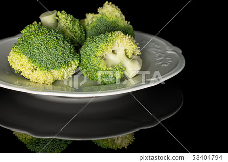 Fresh green broccoli isolated on black glass 58404794