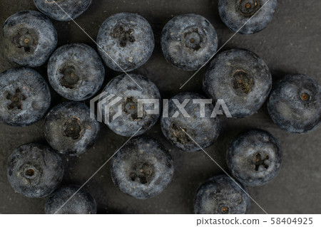 Fresh blueberry on grey stone Fresh blueberry on grey stone 58404925