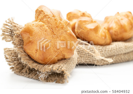 Golden baked profiterole isolated on white 58404932