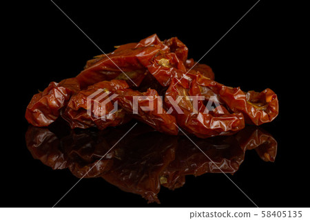 Dry red cherry tomato isolated on black glass Dry red cherry tomato isolated on black glass 58405135
