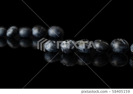 Fresh blueberry isolated on black glass 58405159