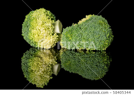 Fresh green broccoli isolated on black glass Fresh green broccoli isolated on black glass 58405344