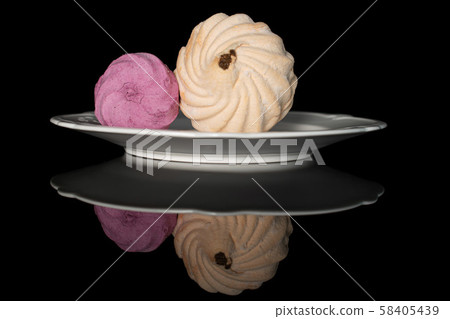 Fresh pastel sweet zefir isolated on black glass 58405439