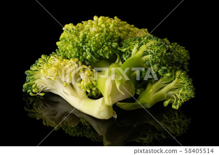 Fresh breen broccoli isolated on black glass 58405514