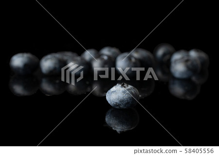 Fresh blueberry isolated on black glass 58405556