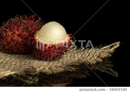 Fresh red rambutan isolated on black glass 58405599