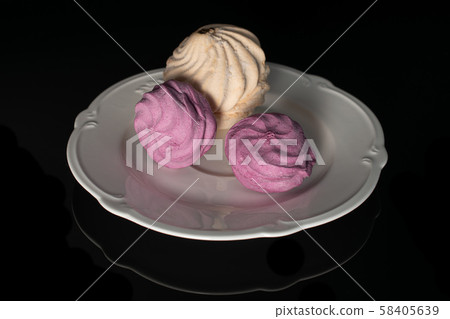 Fresh pastel sweet zefir isolated on black glass 58405639