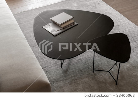 Metal black tables with books in modern interior 58406068