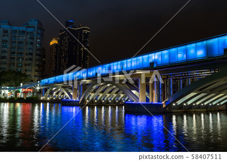 Illuminated night view of Kaohsiung's buildings and Love River 58407511