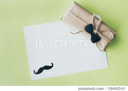 Father's day. Gift package wrapped with paper and Father's day. Gift package wrapped with paper and 58408543