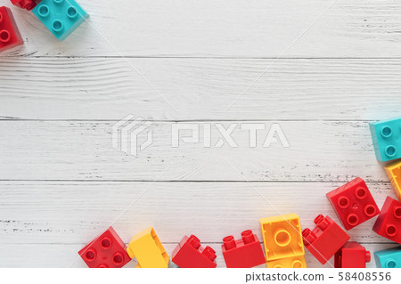 Plastic constructor bricks on white wooden 58408556