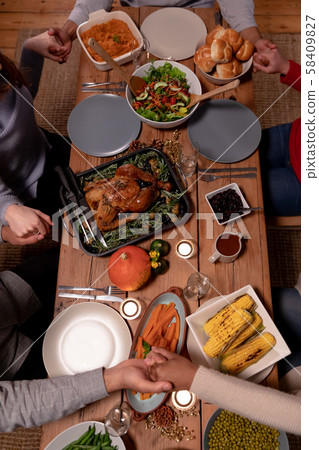 Millennial adult friends celebrating Thanksgiving together at home 58409827