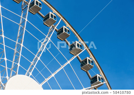 Closeup part of ferris wheel over the blur sky 58410780