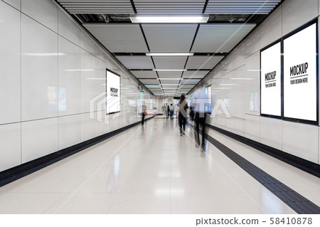 Blank billboard located in underground hall or subway for advertising, mockup concept, Low light speed shutter 58410878