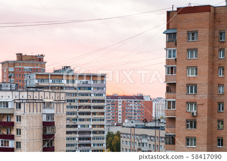 pink sunset sky over residential quarter in city 58417090