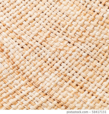 texture of straw hat from interwoven raffia fibers texture of straw hat from interwoven raffia fibers 58417131