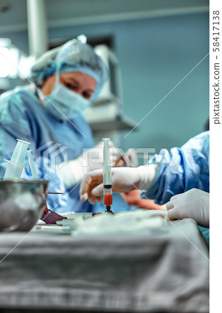 Fat From Liposuction in Syringes with Stainless Stand in Operation Room Fat From Liposuction in Syringes with Stainless Stand in Operation Room 58417138