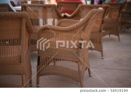 rattan chairs outside cafe summer terrace closeup rattan chairs outside cafe summer terrace closeup 58419194