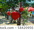 Red hearts hang on a tree. Composition for Valentine's Day. Day of Love. Love as the fruits  58420956