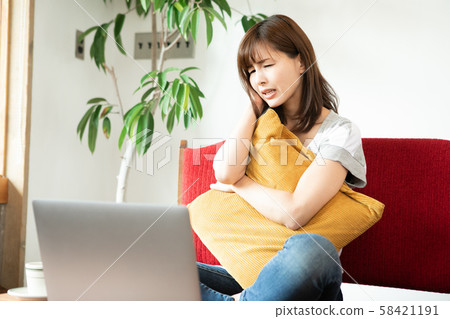 Women watching videos on a computer Women watching videos on a computer 58421191