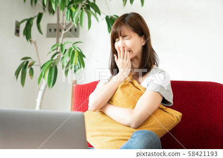 Women watching videos on a computer Women watching videos on a computer 58421193