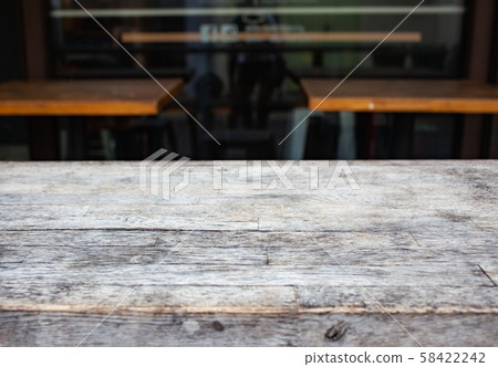 wooden table  and blurred street scene in the 58422242