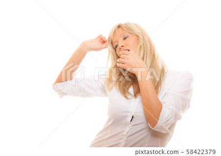 Sleepy tired woman yawning covering mouth with 58422379
