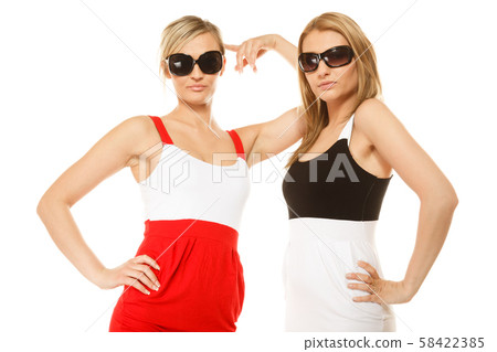 two sexy crazy women in summer clothes sunglasses. two sexy crazy women in summer clothes sunglasses. 58422385