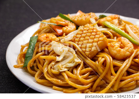 Seafood soy sauce fried noodles. 58423537