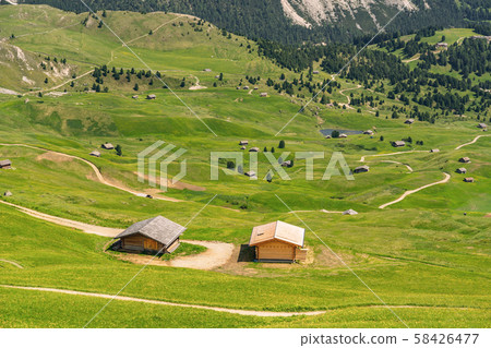 Scenic Alps with wooden house on hill 58426477