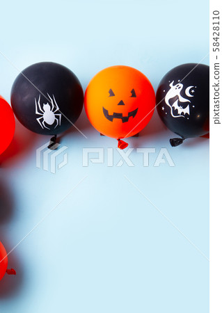 Halloween scene with balloons 58428110