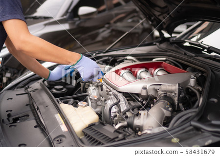 Check the oil level in car engine Check the oil level in car engine 58431679