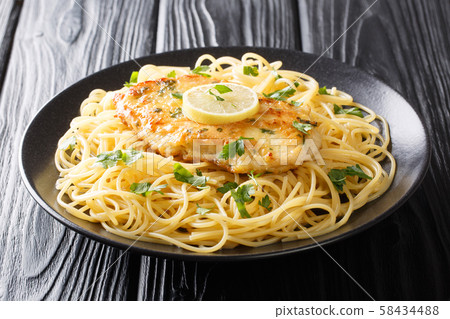 Roasted breaded chicken Francaise with a side dish Roasted breaded chicken Francaise with a side dish 58434488