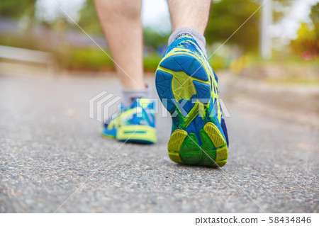 Close up on shoe, Runner athlete feet running on Close up on shoe, Runner athlete feet running on 58434846