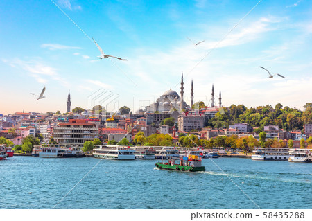 Eminonu Pier and Suleymaniye Mosque in Istanbul, Turkey 58435288