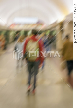 Abstract blurred image unrecognizable young guy with a backpack, group of people in arched corridor Abstract blurred image unrecognizable young guy with a backpack, group of people in arched corridor 58435414