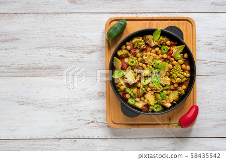 Curry with romanesco cabbage and rice. Top view. 58435542