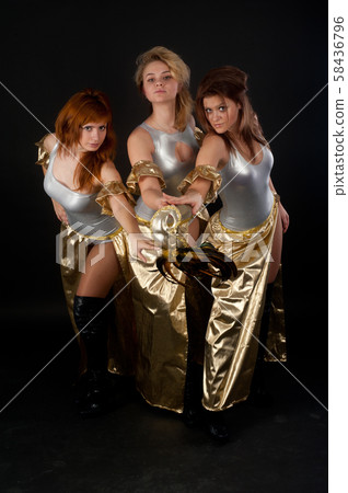 Three pretty girls dancing 58436796