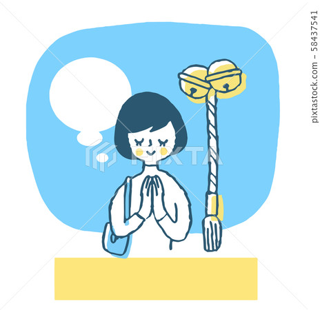 A woman visiting at a shrine 58437541