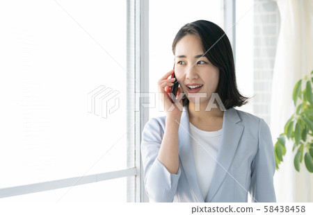business woman calling 58438458