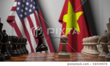 Flags of the USA and Vietnam behind pawns on the chessboard. Chess game or political rivalry related 58439978