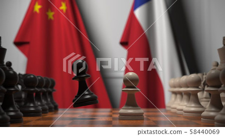 Flags of China and Chile behind pawns on the chessboard. Chess game or political rivalry related 3D 58440069