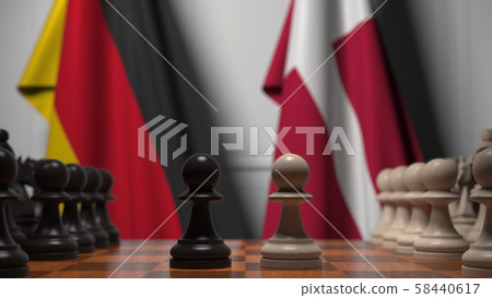 Flags of Germany and Denmark behind pawns on the chessboard. Chess game or political rivalry related 58440617