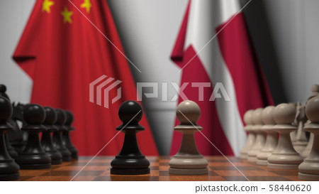 Flags of China and Denmark behind pawns on the chessboard. Chess game or political rivalry related Flags of China and Denmark behind pawns on the chessboard. Chess game or political rivalry related 58440620